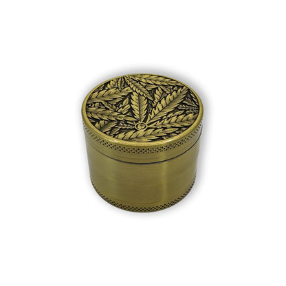 Bild von oben: Gold Leaves Grinder Draufsicht - Goldener Grinder mit Cannabisblättern und 3D-Design